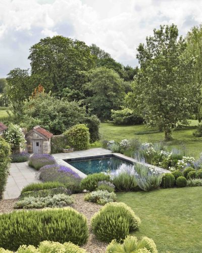 View south over herb beds to pool from dining terrace
